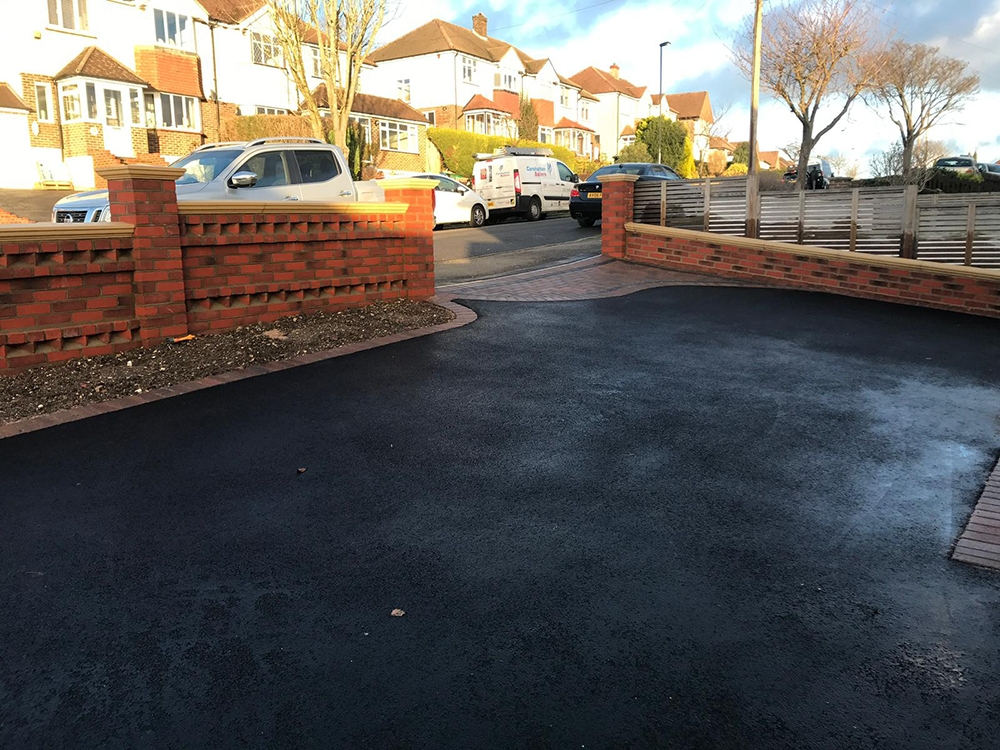 Completed tarmac driveway with block paving apron Completed tarmac driveway with block paving apron